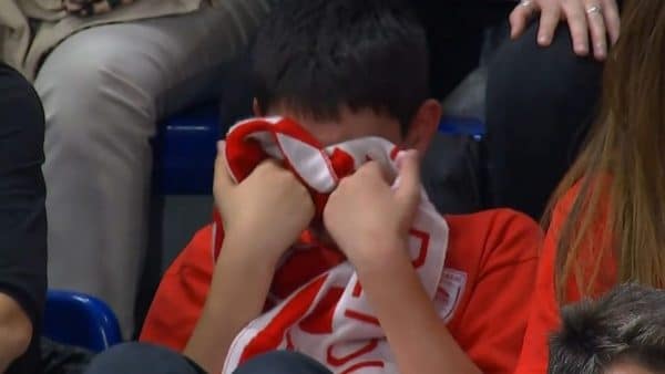 Olympiacos' fan crying after the loss from Barcelona